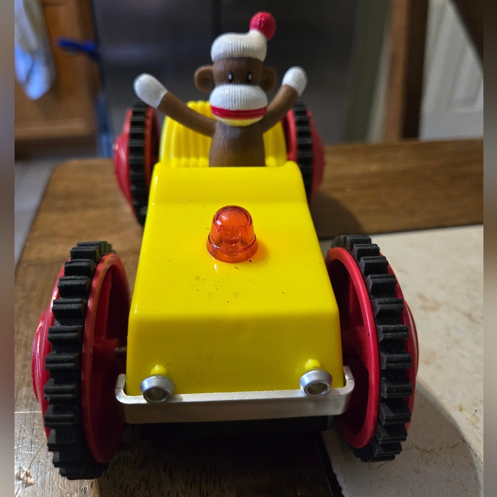 Sock Monkey Tumbling Car  Battery Operated Toy 7” Long Car